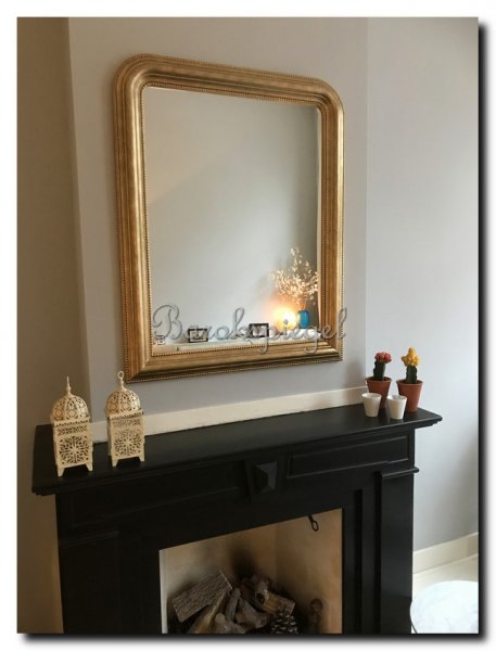 toogspiegel-goud-boven-zwarte-schouw
